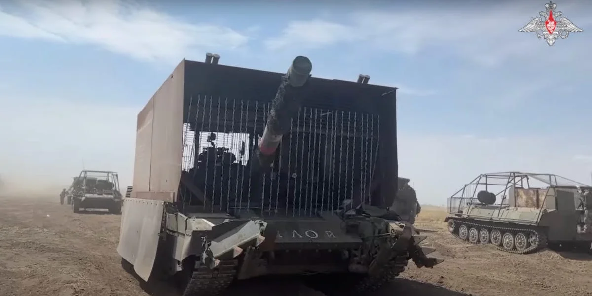 Anti-drone cage armor installation on military vehicle