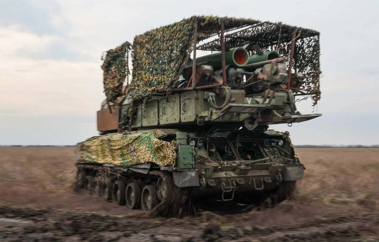 BMP-2 with cope cage armor installed