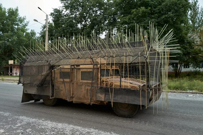 Combat-tested cope cage armor on tank