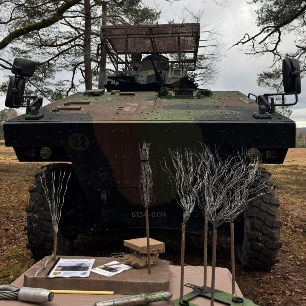 Anti-drone cage armor protecting vehicle from aerial threats